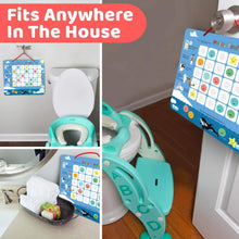 a doll is sitting on a table next to a laptop