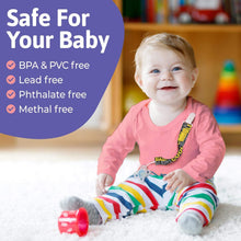 a little girl sitting on a snow covered ground