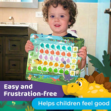 a little girl sitting in front of a birthday cake