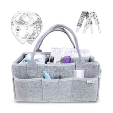 a statue of a man sitting on a stone wall