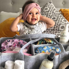 a woman sitting in a chair with a stuffed animal